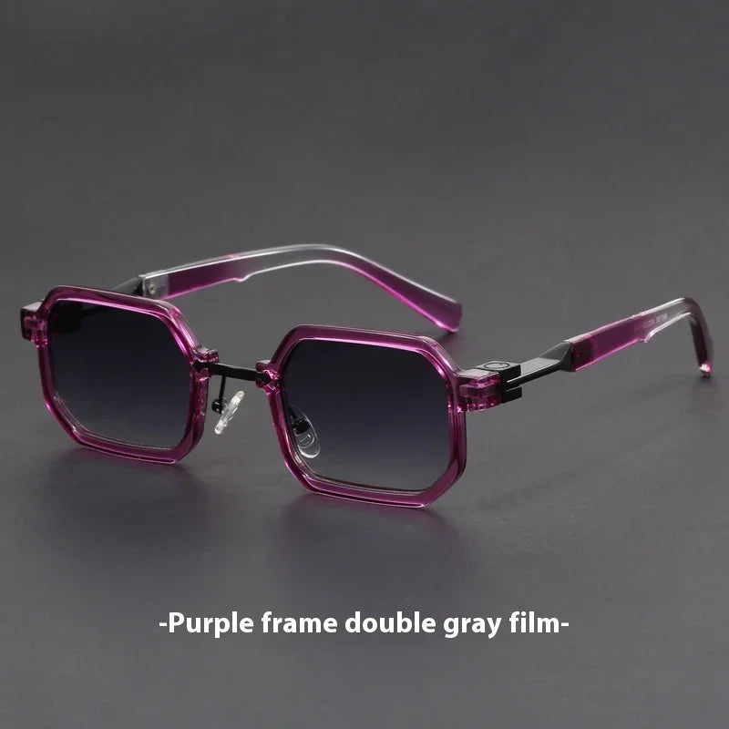 Geometric purple translucent sunglasses with gray gradient lenses on dark surface