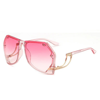 Pink gradient oversized geometric sunglasses with transparent pink frames and gold temples