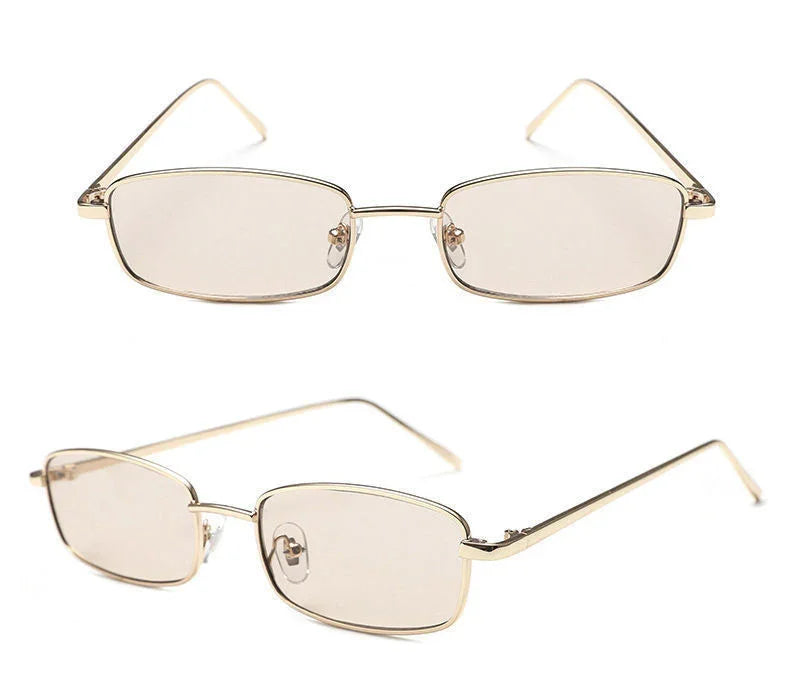 Slim rectangular eyeglasses with gold metal frame and tinted lenses on white background