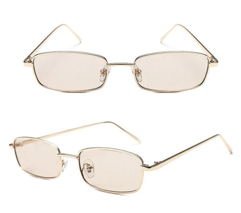 Slim rectangular eyeglasses with gold metal frame and tinted lenses on white background