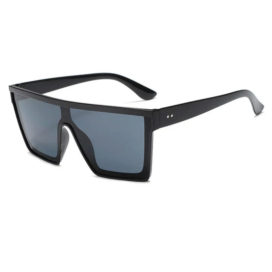 Black oversized rectangular sunglasses with dark tinted lenses and thick frame