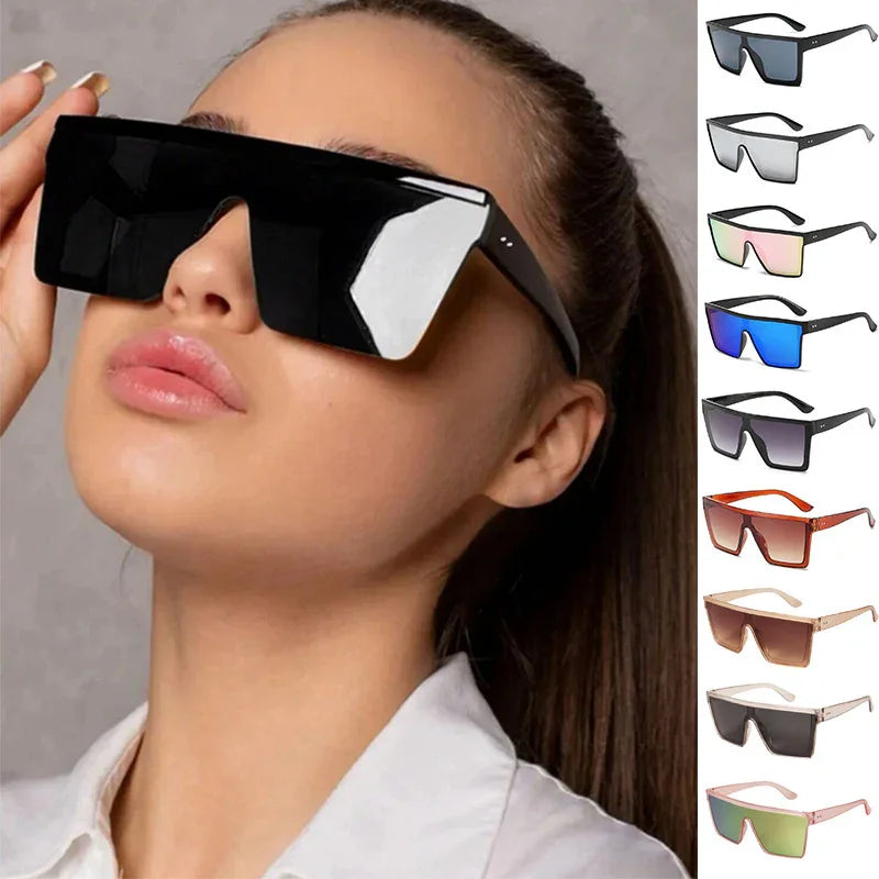 Model wearing oversized black shield sunglasses with additional color options displayed