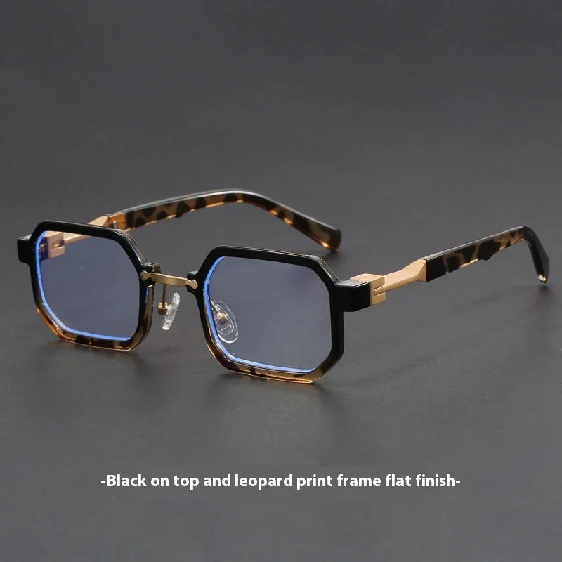 Rectangular eyeglasses with black and leopard print frames and blue tinted lenses on dark surface