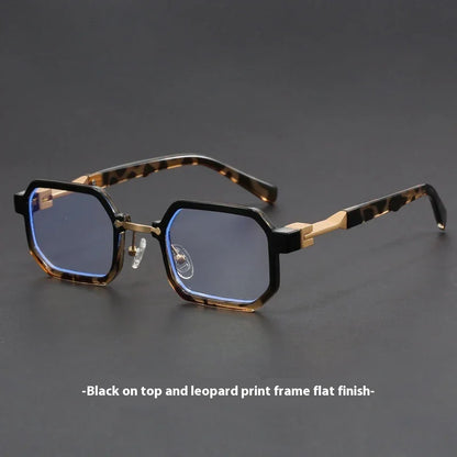 Rectangular eyeglasses with black and leopard print frames and blue tinted lenses on dark surface
