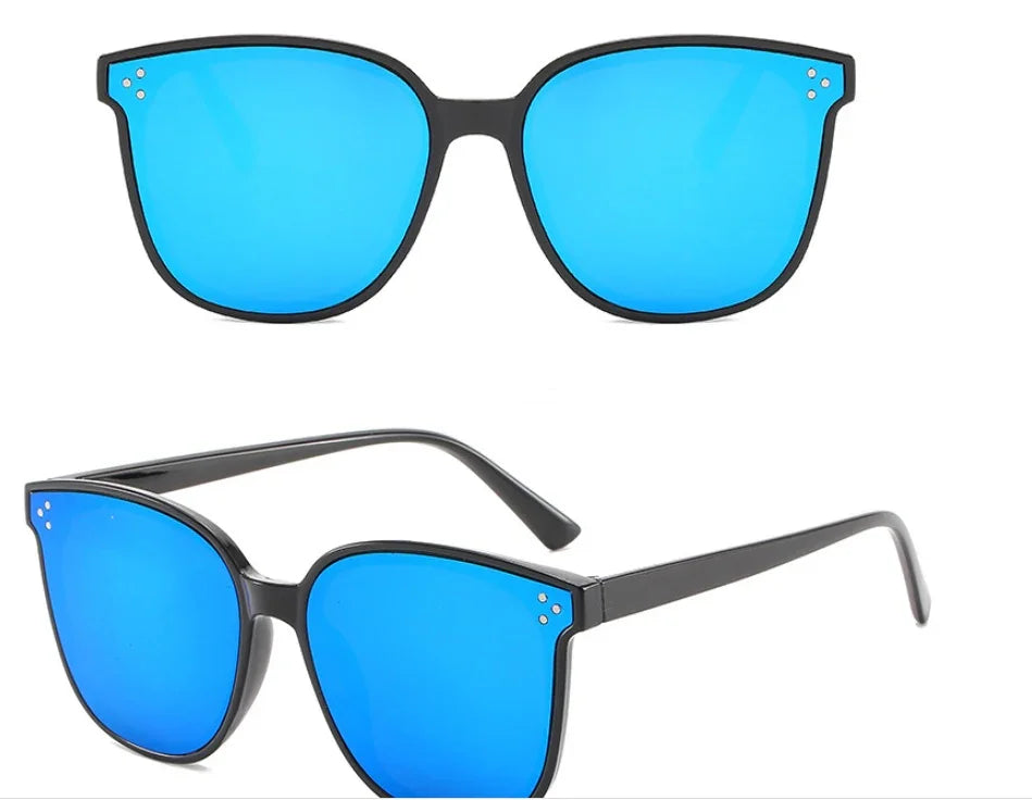 Black frame sunglasses with reflective blue lenses and three small decorative dots on each corner
