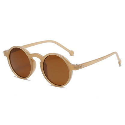 Round beige frame sunglasses with brown tinted lenses on a white background