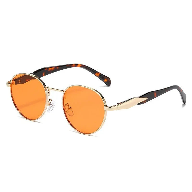 Round sunglasses with orange lenses, gold metal frames, and tortoiseshell arms