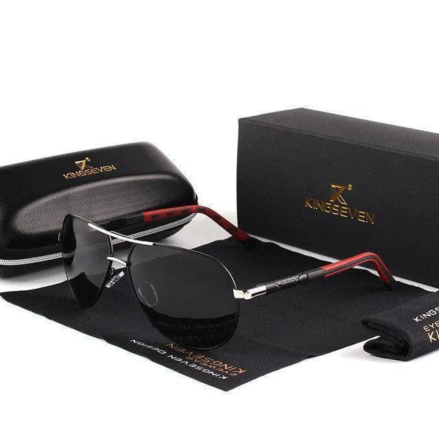 Stylish black and silver polarized sunglasses with dark lenses and red-accented arms, displayed with protective case and cleaning cloth