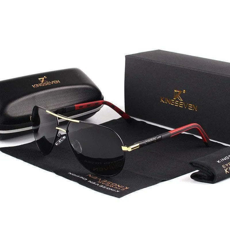 Men's black aviator polarized sunglasses with gold and red accents displayed with black case and cleaning cloth