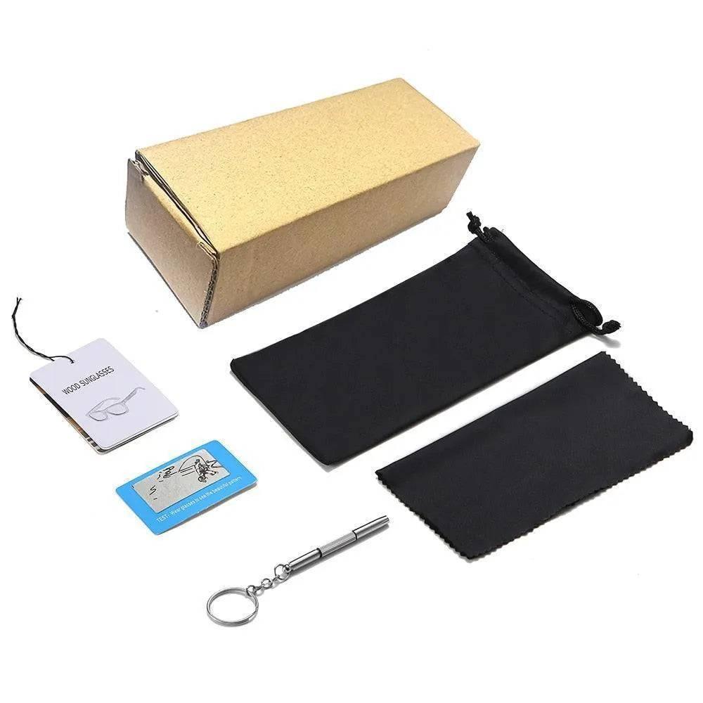 brown cardboard box with black drawstring pouch, cleaning cloth, small screwdriver keychain, and wood sunglasses tags