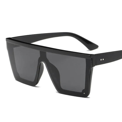 Oversized black square fashion sunglasses with dark lenses and thick frames