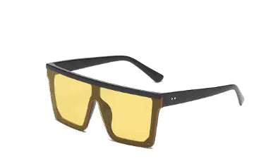 Oversized square fashion sunglasses with black frame and yellow tinted lenses
