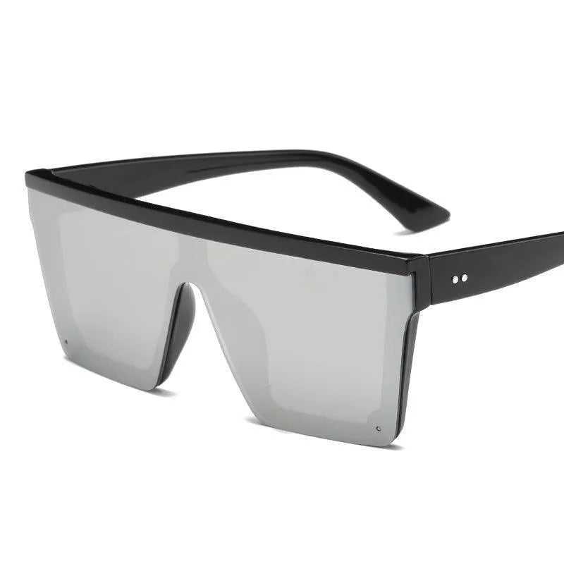Oversized square fashion sunglasses with black frame and reflective gray lenses