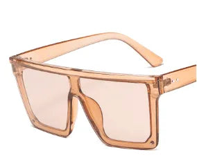 Oversized square fashion sunglasses with transparent peach-colored frame and light lenses
