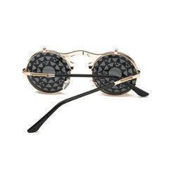 Round black lenses steampunk sunglasses with gold metal frame and intricate geometric lens design