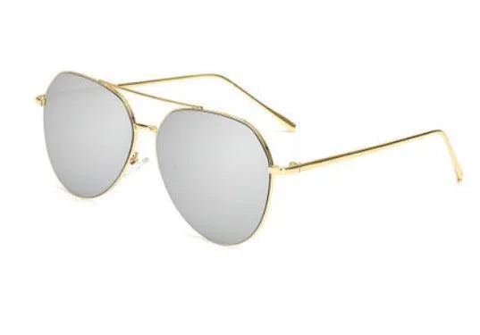 gold metal aviator sunglasses with reflective silver lenses on white background