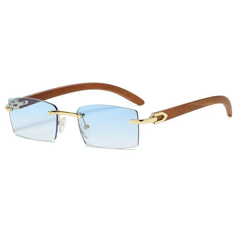 Rimless square sunglasses with clear blue lenses, gold bridge, and wooden temples