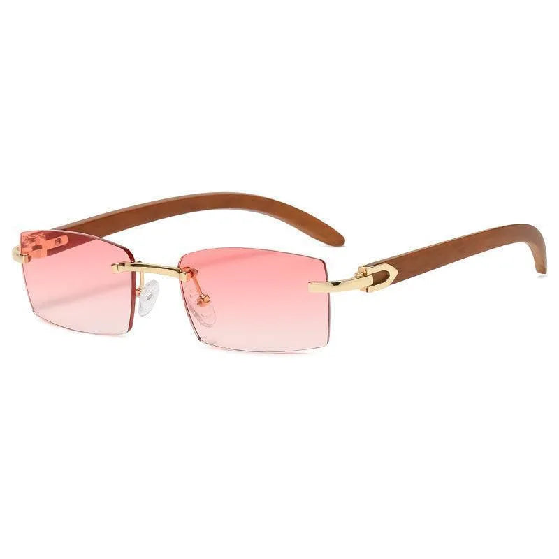 Rimless sunglasses with rectangular pink gradient lenses, gold bridge, and brown arms