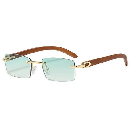 Rimless men's sunglasses with gradient grey lenses, gold frame, and brown arms on white background