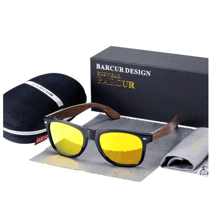 Gloss black sunglasses with wooden arms and yellow polarized lenses displayed with case and cleaning cloth