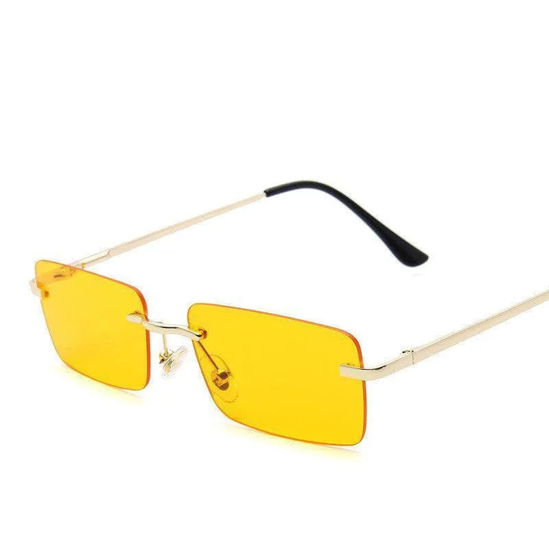 Rimless square sunglasses with yellow lenses and gold metal temples on white background