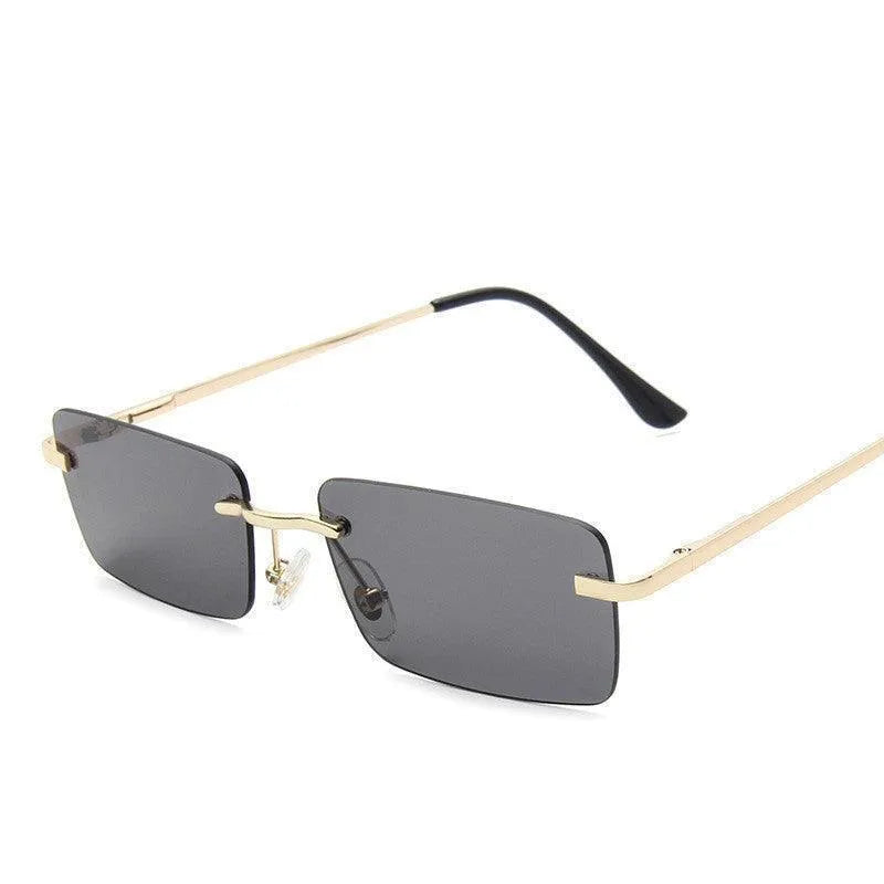 Rimless square sunglasses with gold metal temples and dark gray lenses