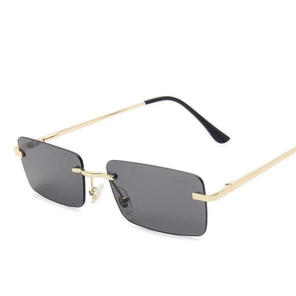 Rimless square sunglasses with gold metal temples and dark gray lenses