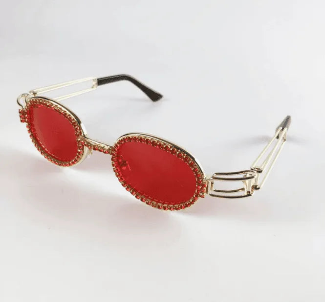 Vintage small round sunglasses with red lenses and gold embellished frames